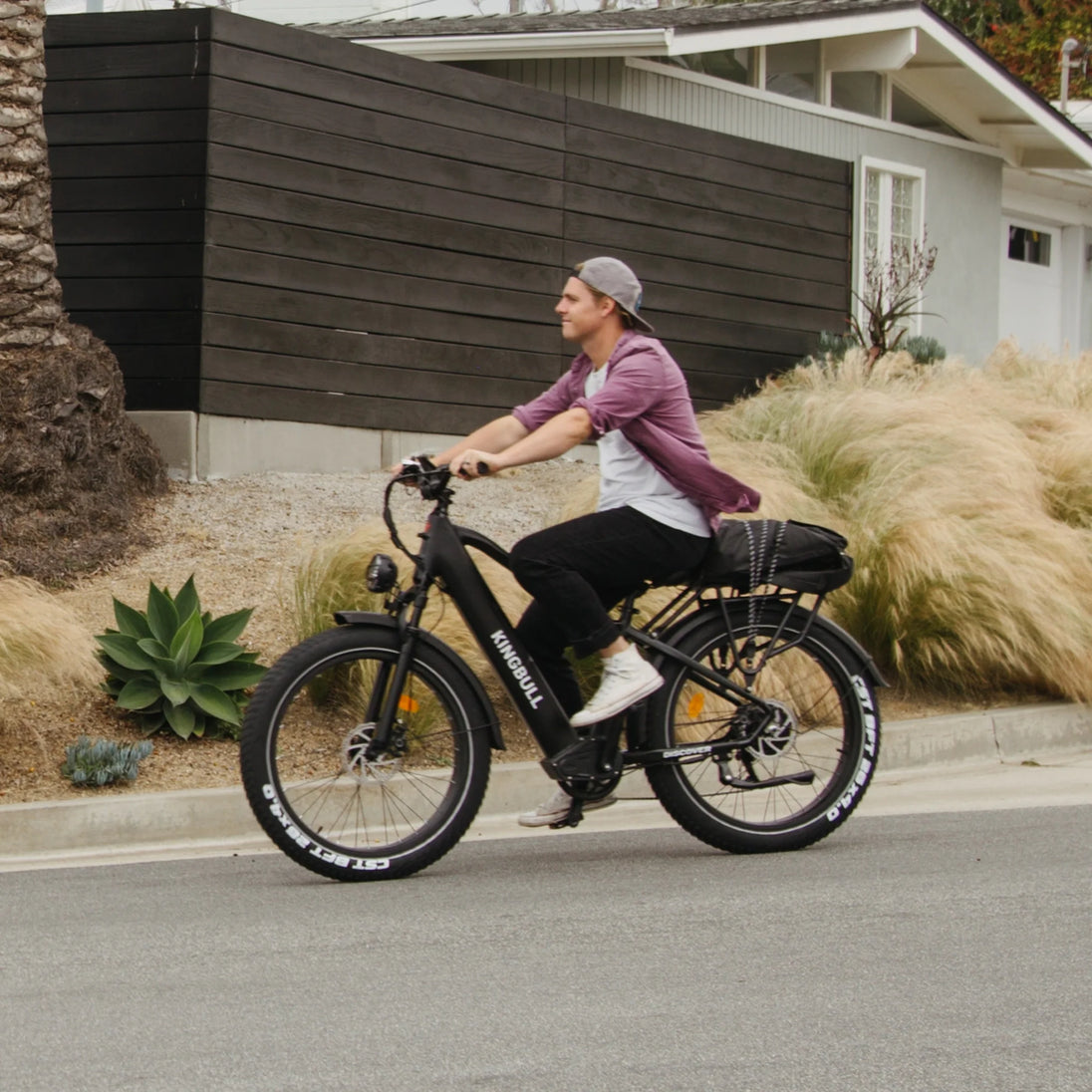 Man riding Kingbull Discover electric bike demonstrating comfortable riding position and performance