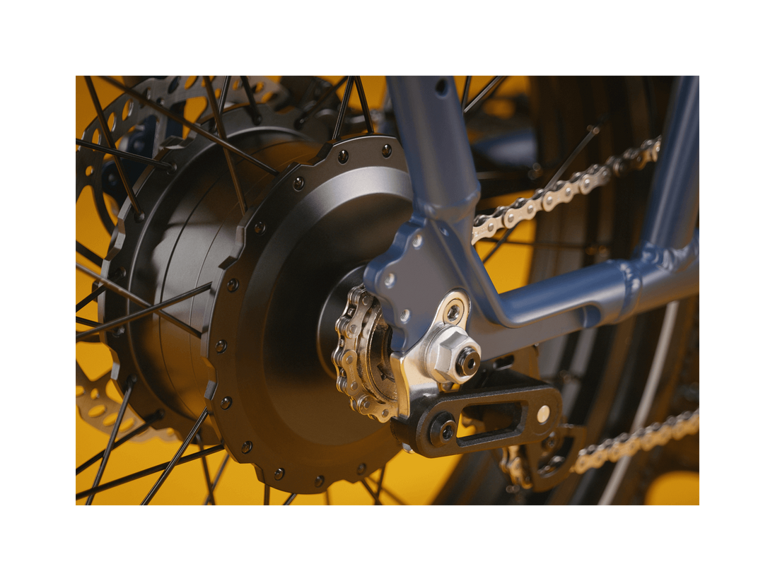 Detailed shot of a blue ebike with a black motor and silver bike chain.
