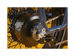 Detailed shot of a blue ebike with a black motor and silver bike chain.