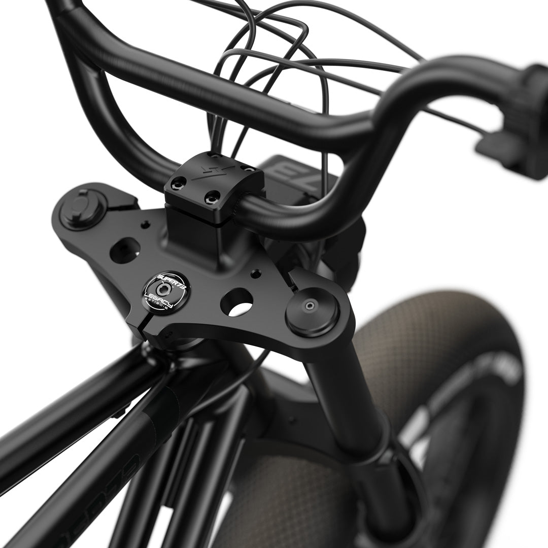 Close-up view of the handlebars and branded stem cap on the SUPER73-ZX SE Legacy Series ebike in blackout @color_blackout